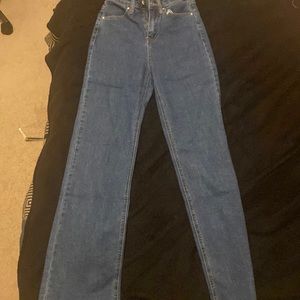 Thigh /butt hugging jeans with loose fitting leg areas